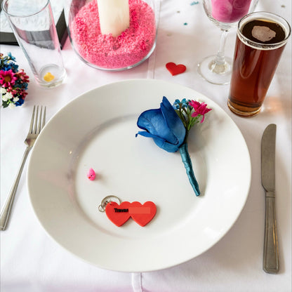 Dinner table setting with a plate, glass, and decorative elements on a white tablecloth.